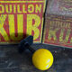 Vintage yellow wooden wall-mounted ball coat hook.