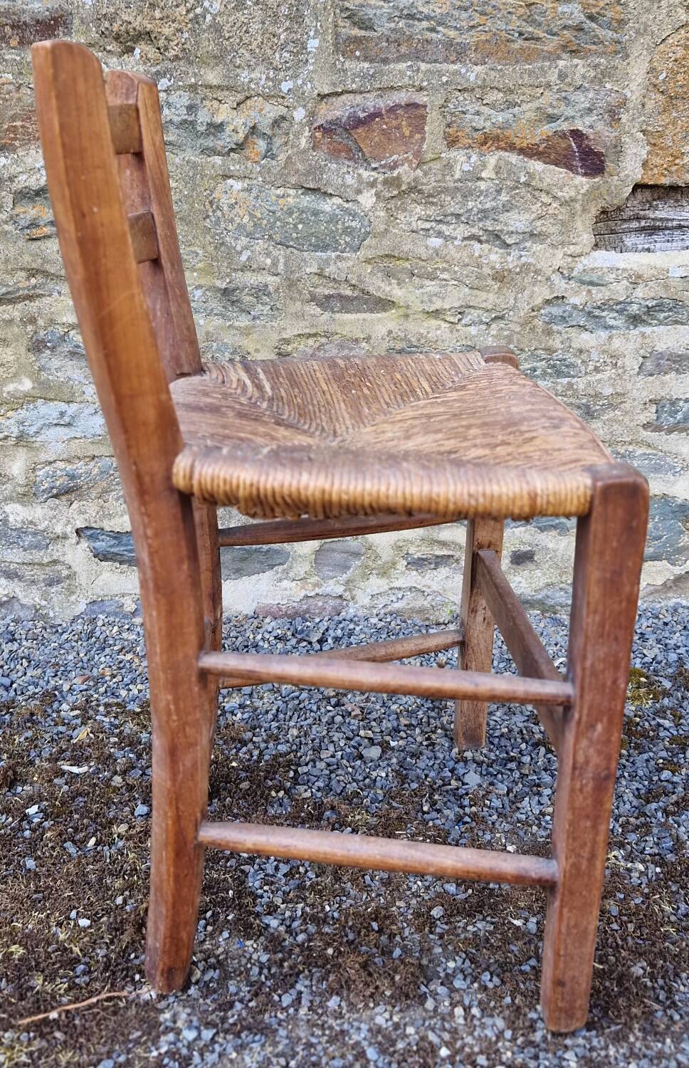 Antique straw chair with low back