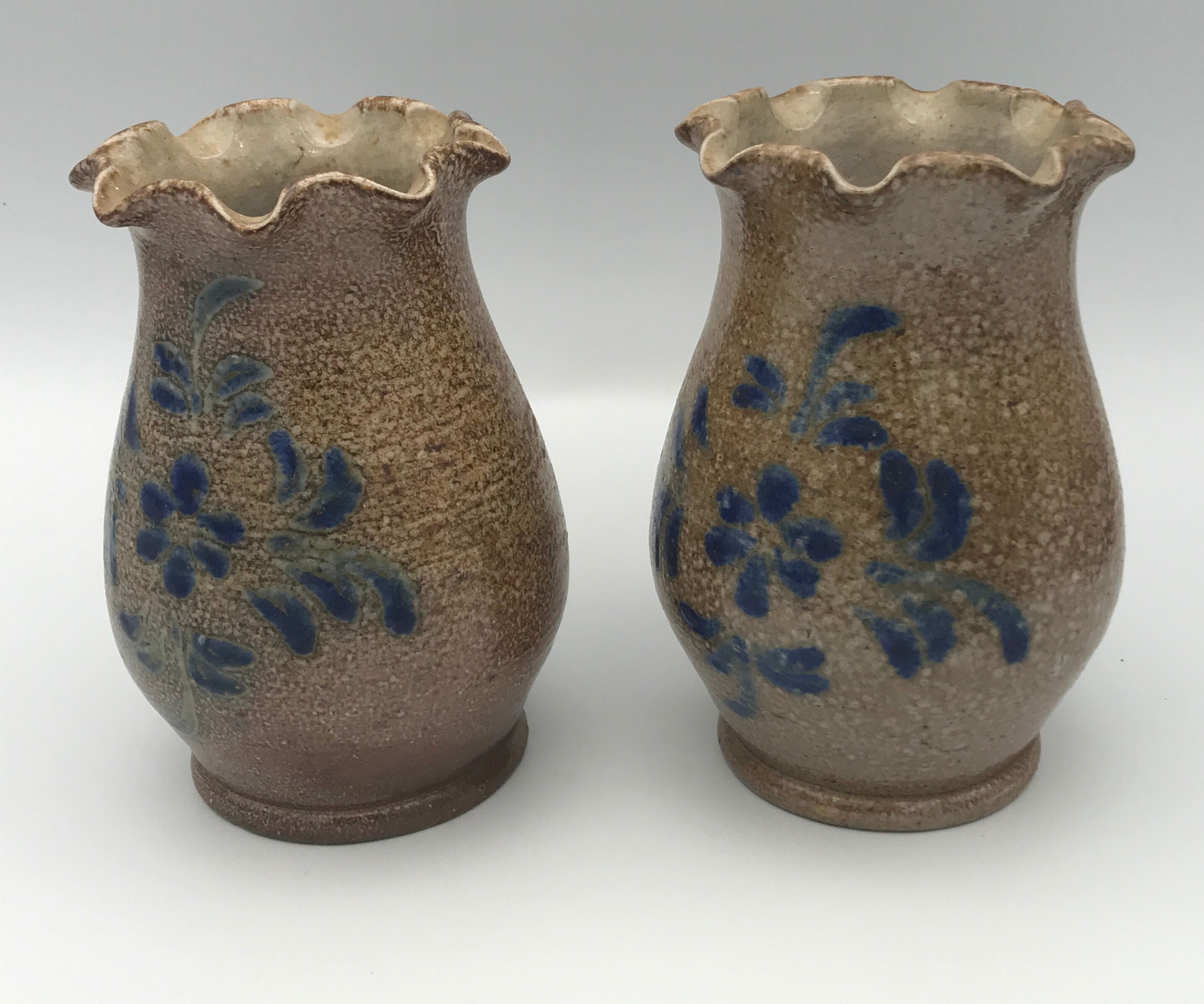 Pair of vintage pottery vases with floral decoration and glaçureau sel