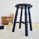 Antique black wooden stool, renovated