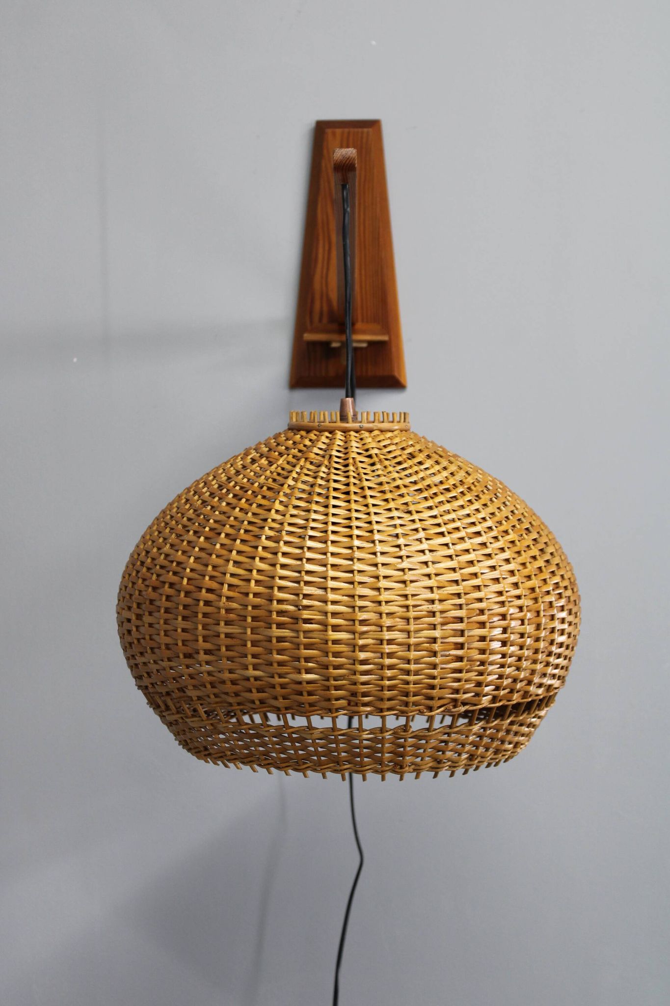 Adjustable mid-century wooden wall lamp with rattan shade, 1970s
