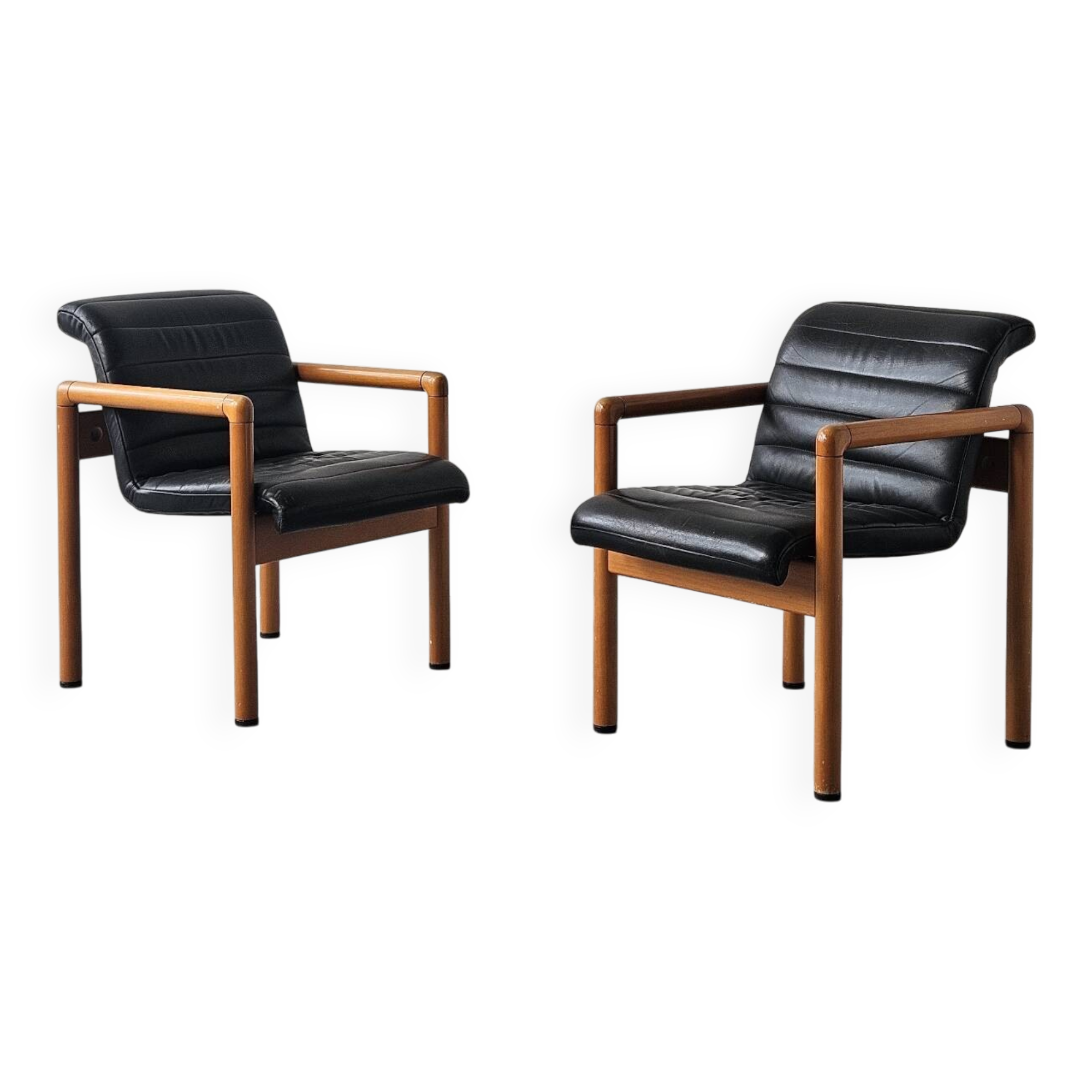 Pair of vintage Flototto armchairs in leather and wood, 1980s.