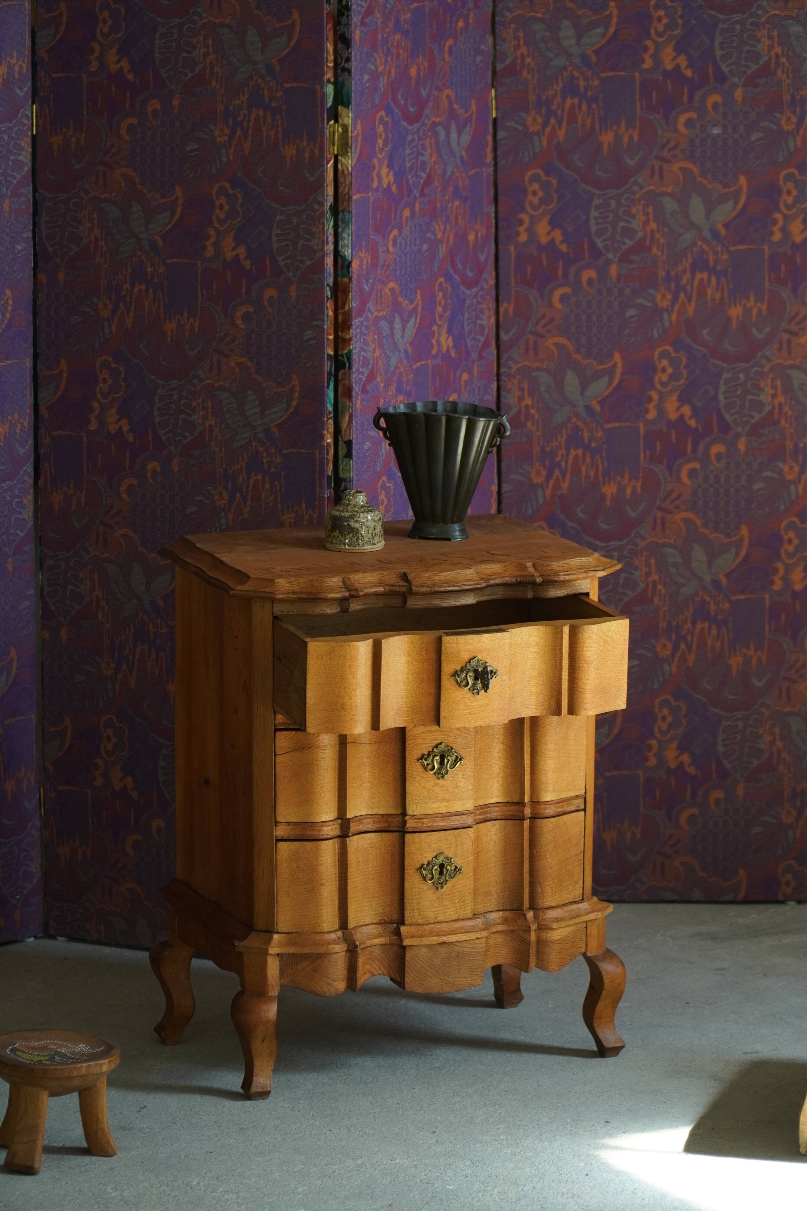 Danish neo-baroque oak commode with three drawers, featuring brass fittings, 1940s.