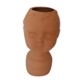 Terracotta vase shape child's head, baby