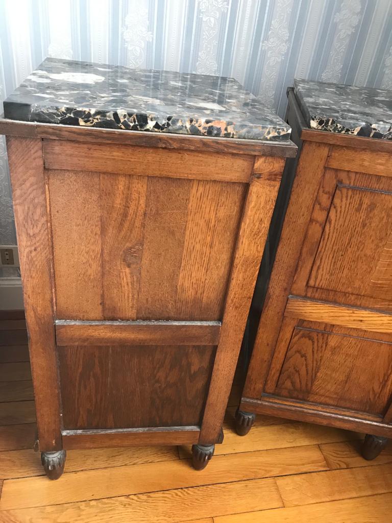 Set of 2 old oak bedside tables above black marble plaque
