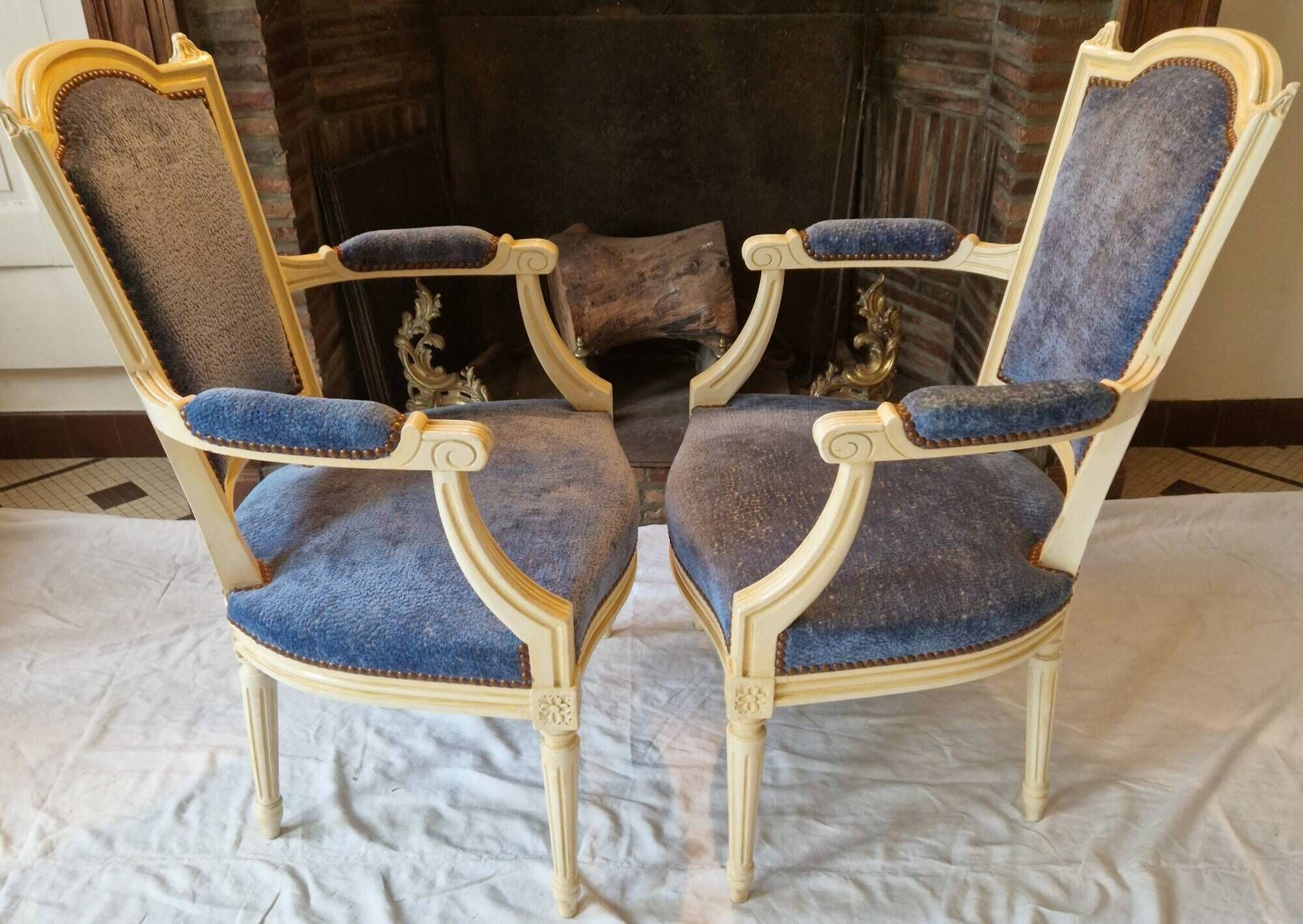 Pair of Louis XVI cabriolet armchairs in cream and blue French elegance late 19th century