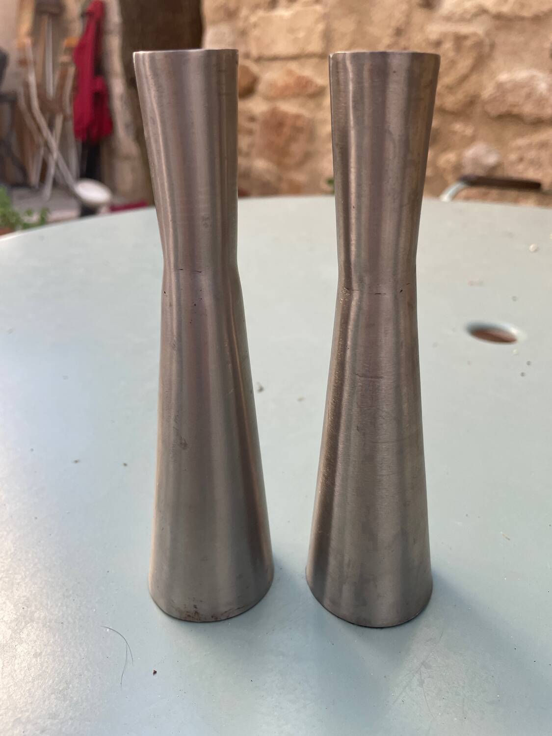 Pair of aluminum candlesticks