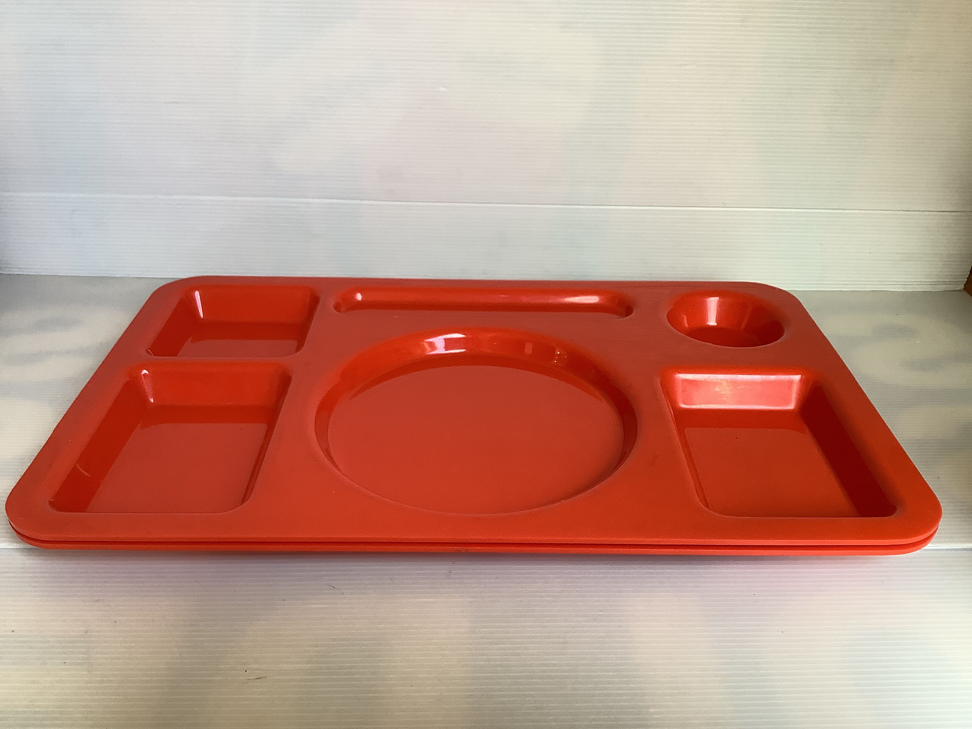 Pair of orange guzzini meal trays