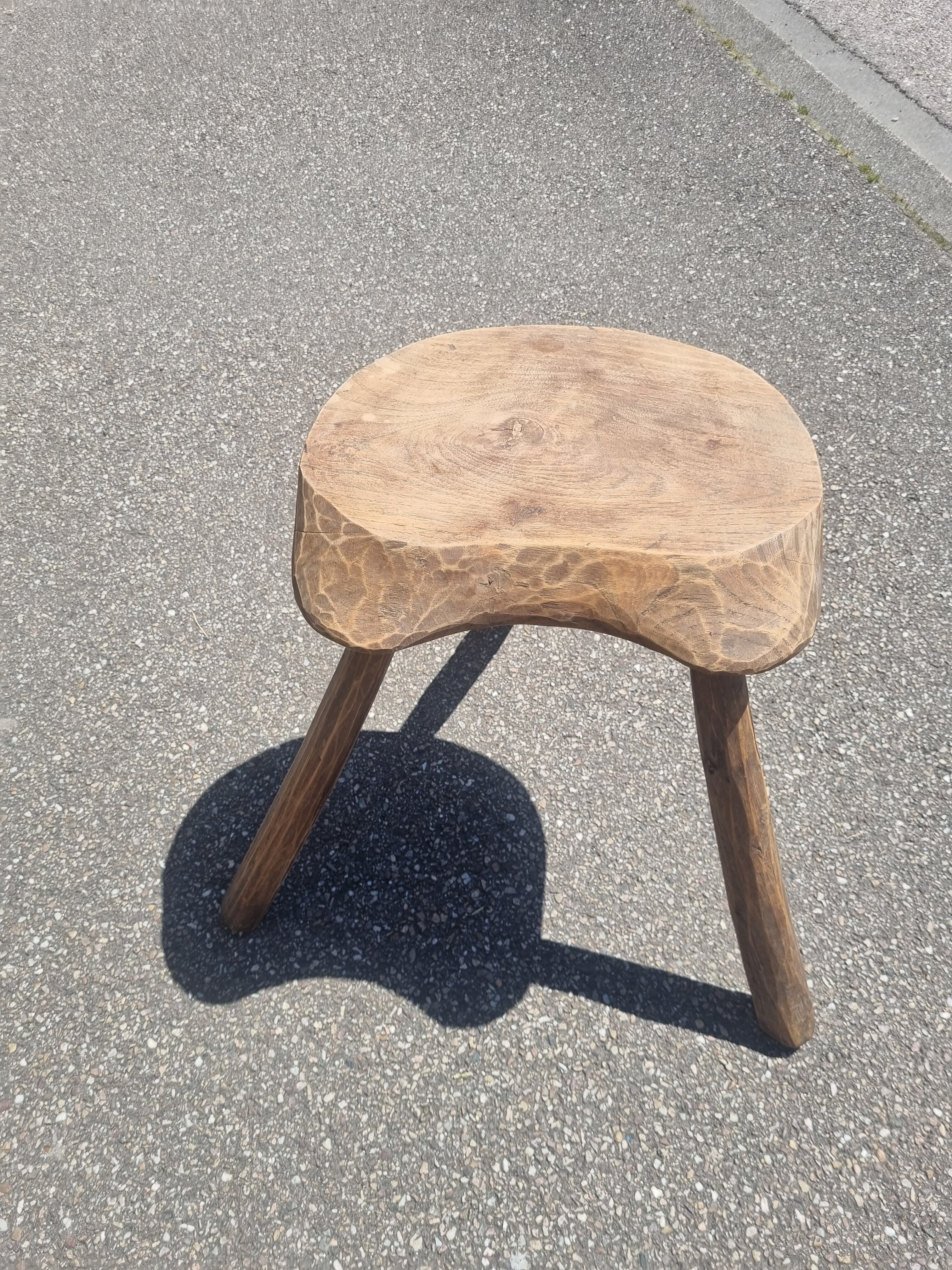 Old wooden tripod stool