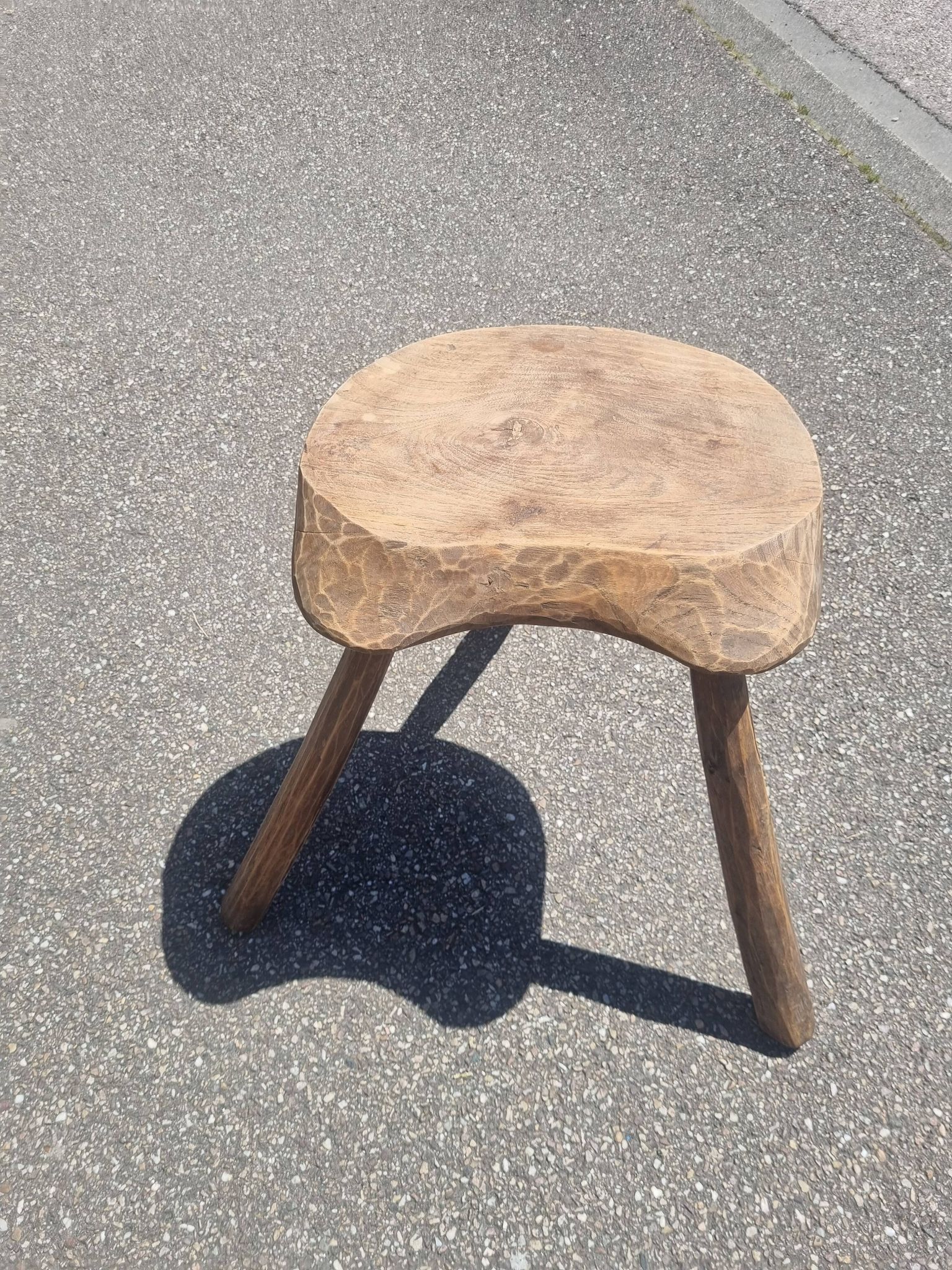 Old wooden tripod stool