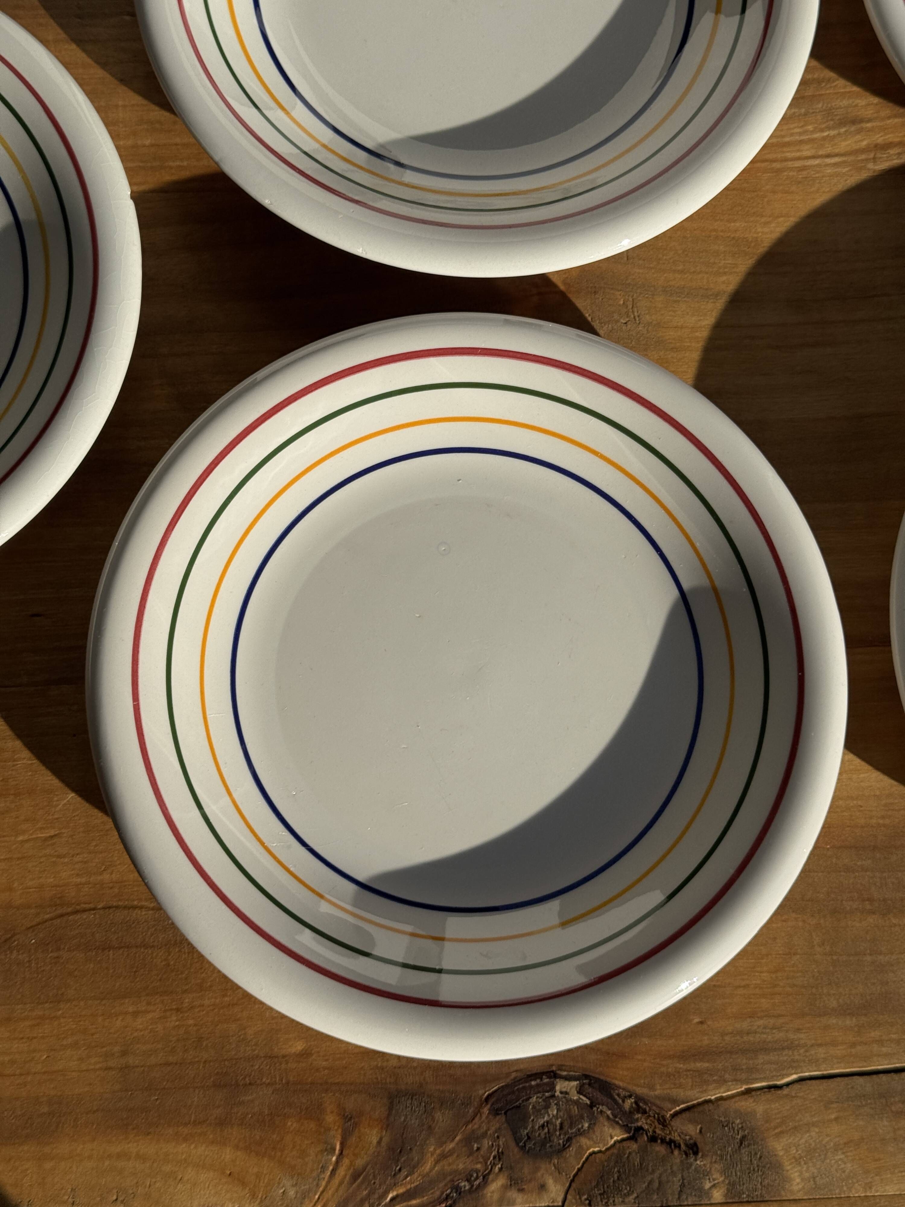 Set of 9 small Italian dessert plates Primula with red and green trim.