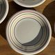 Set of 9 small Italian dessert plates Primula with red and green trim.