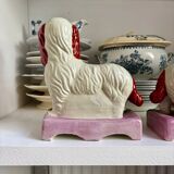 Pair of Staffordshire porcelain Cavalier King Charles dogs on terrace, 19th century.