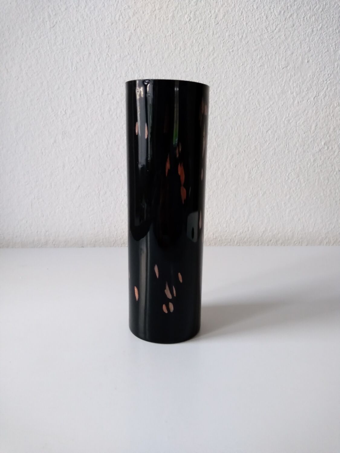 Black opaque glass vase with minimalist style copper inlays