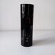 Black opaque glass vase with minimalist style copper inlays