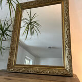 Gilded mirror with antique wood and stucco frame