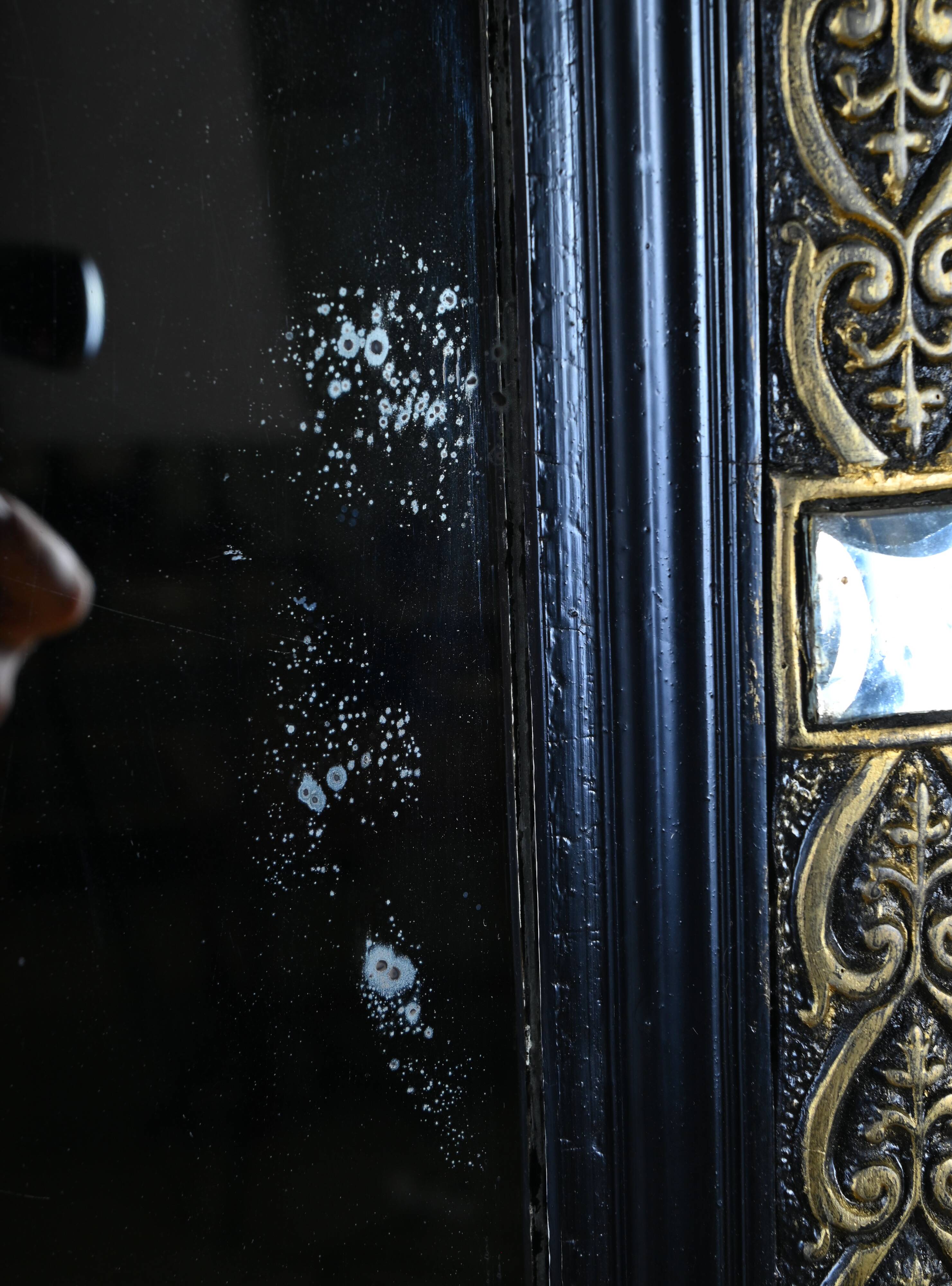 Black and gold Napoleon III mirror, 19th century, 115x86cm