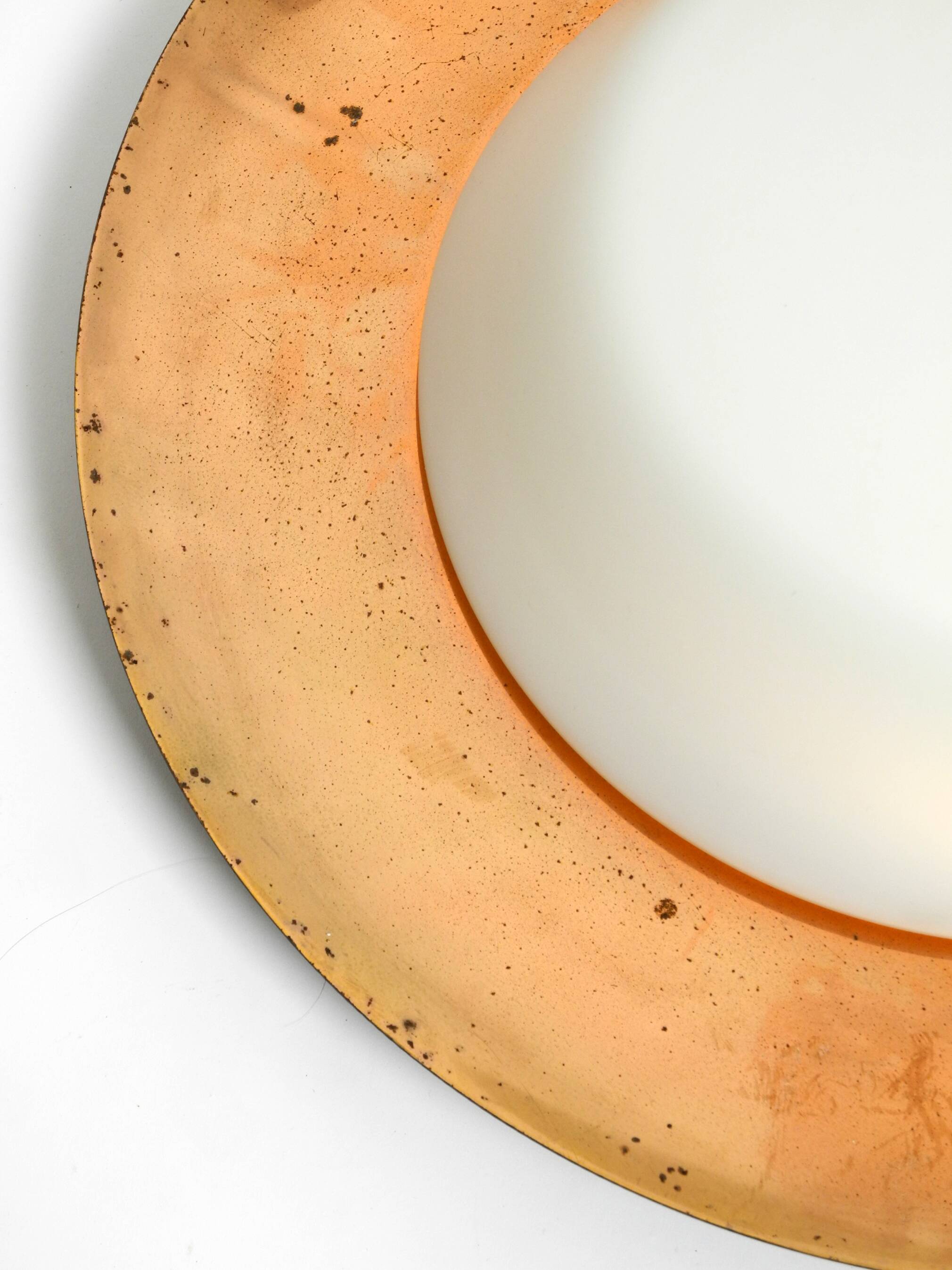 Pair of Mid Century wall or ceiling lamps made of glass with copper-plated