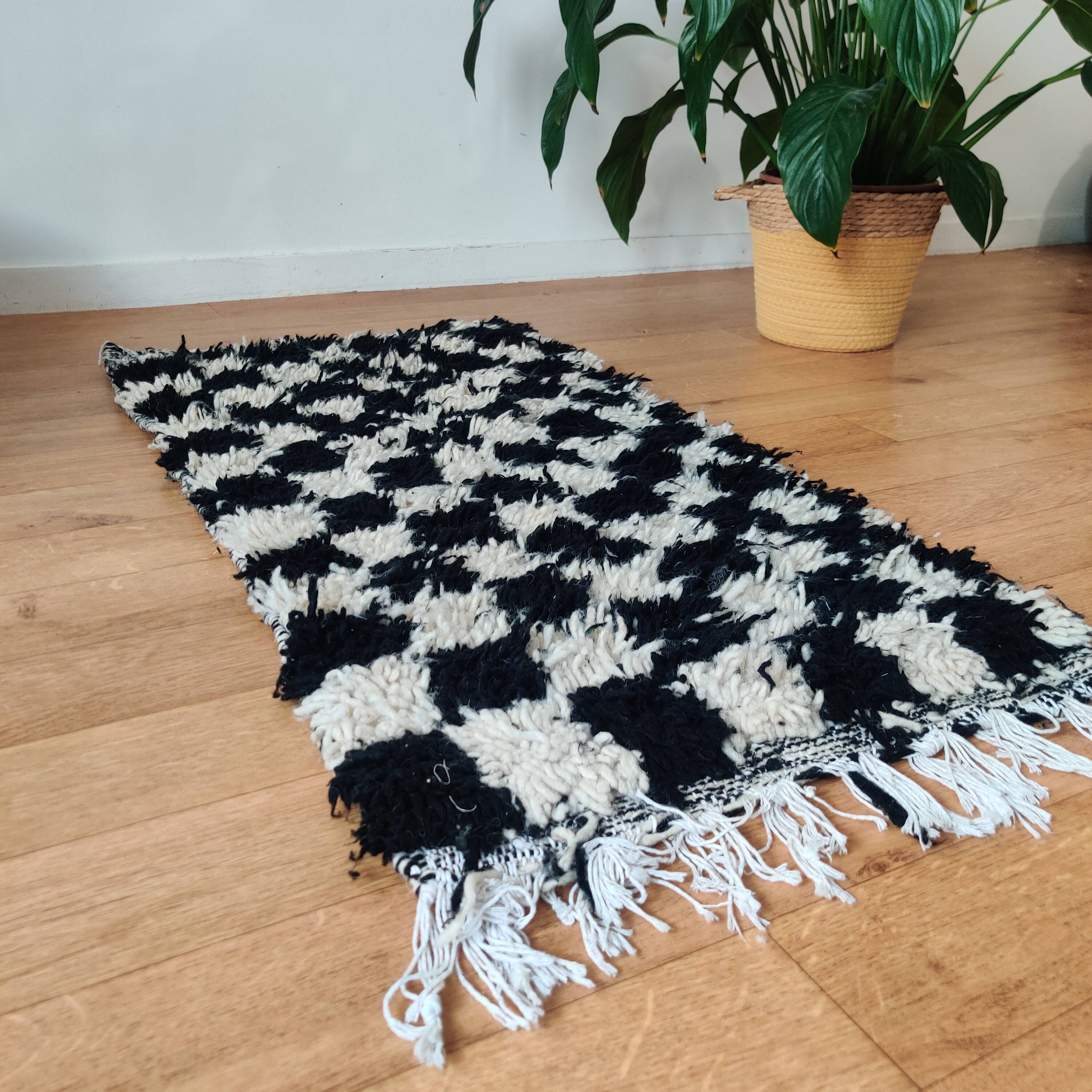 Small black tile Berber rug