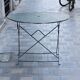 Folding wrought iron garden table