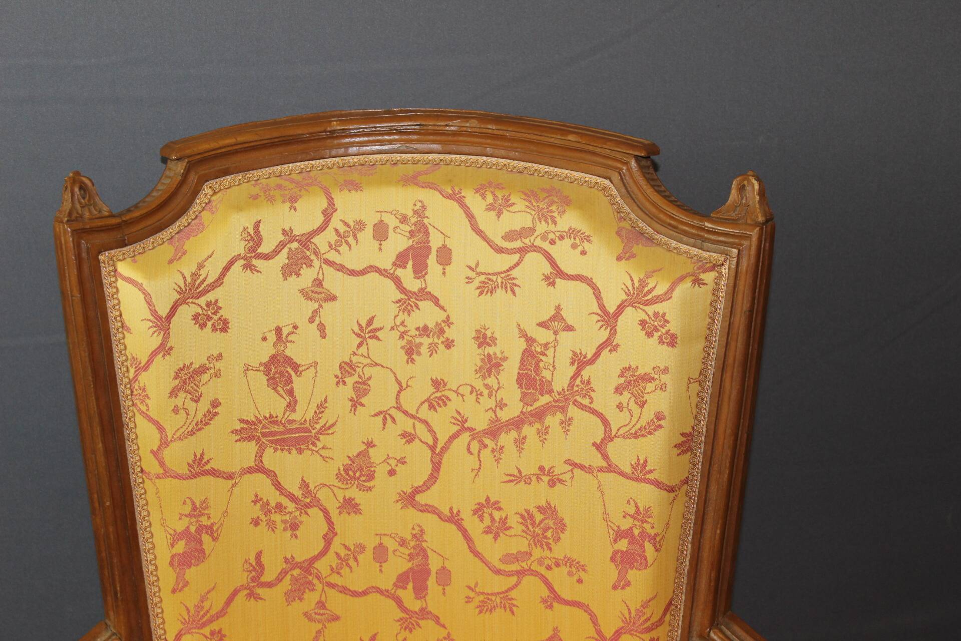 Pair of Louis XVI Bergères in walnut, late 18th century.