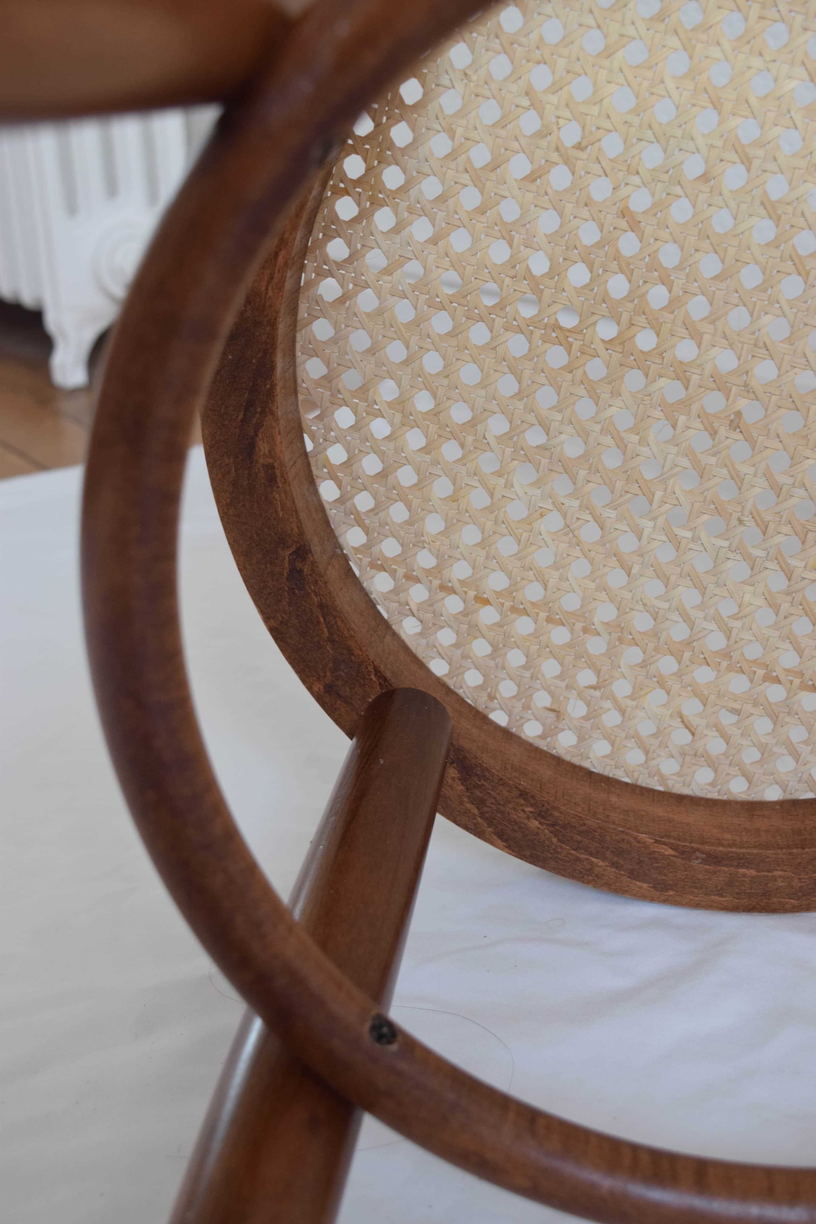 Curved wooden bistro and canne seating
