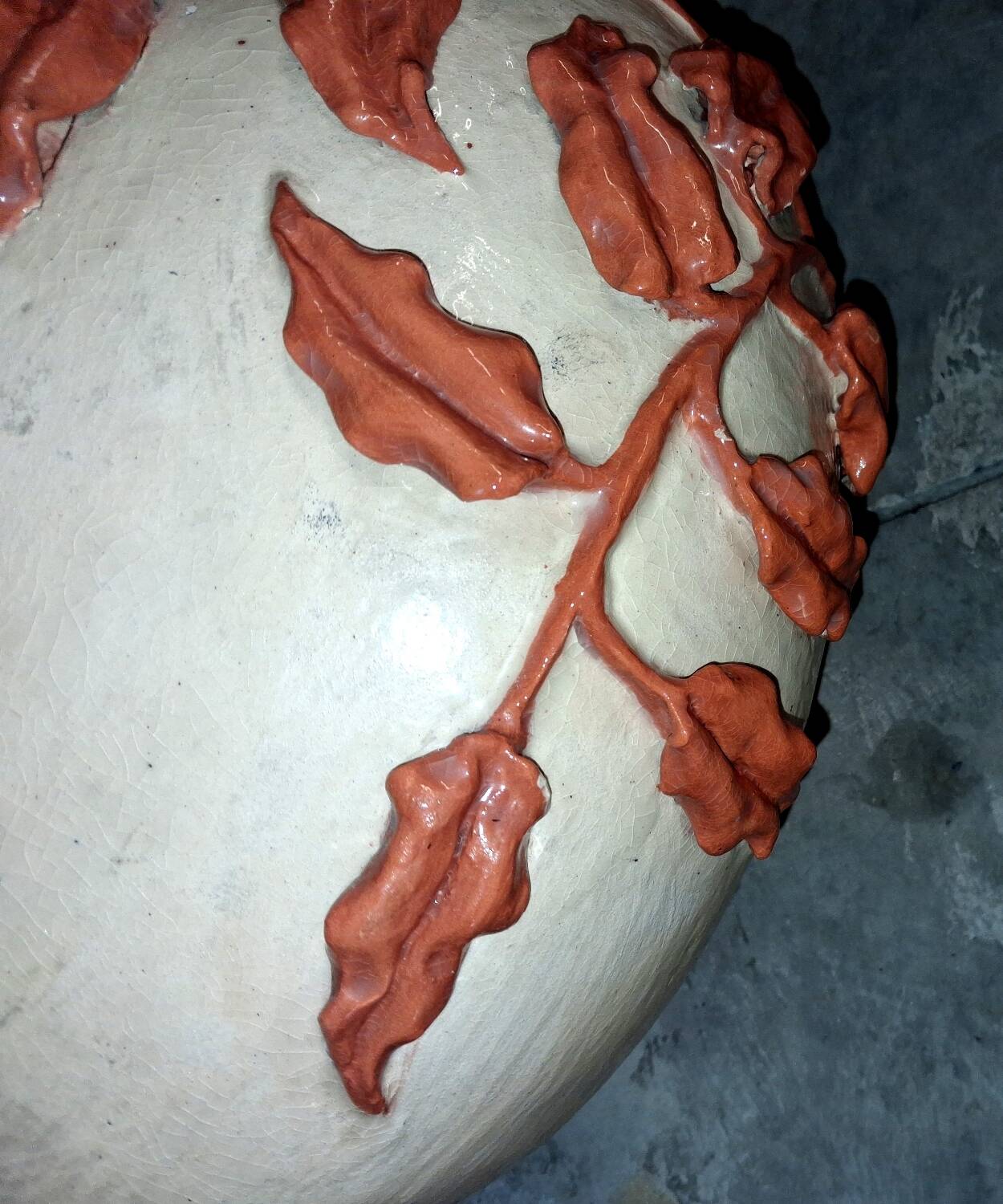Large vase with relief plant decoration, raw art.