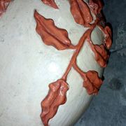 Large vase with relief plant decoration, raw art.