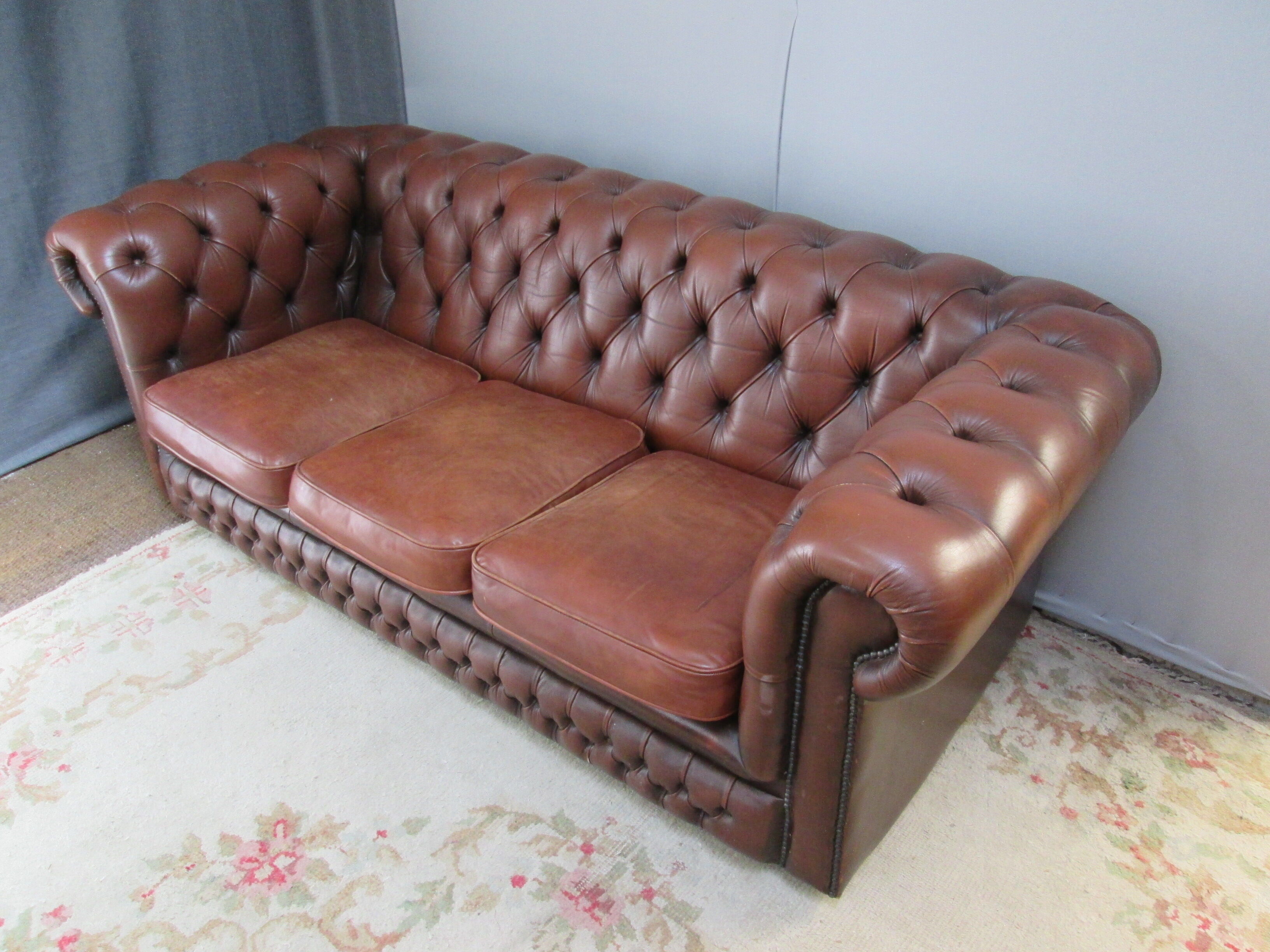 Brown leather chesterfield sofa