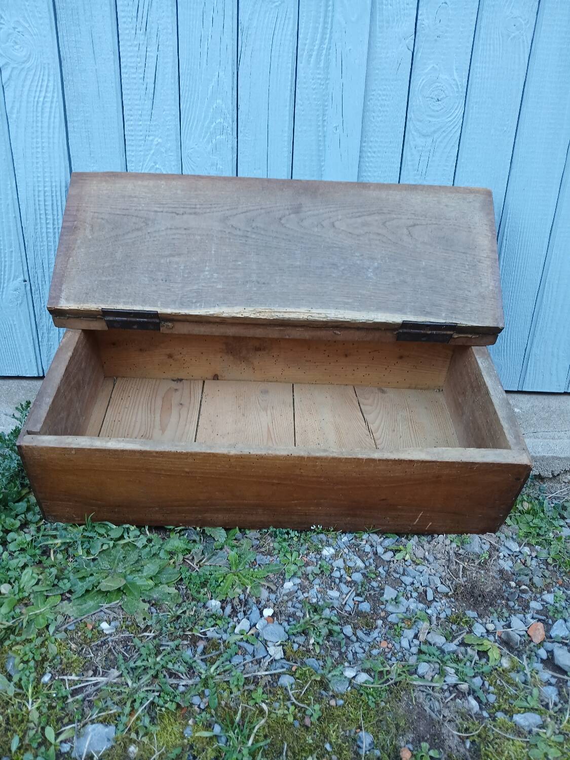 Small old wooden chest with hinged lid