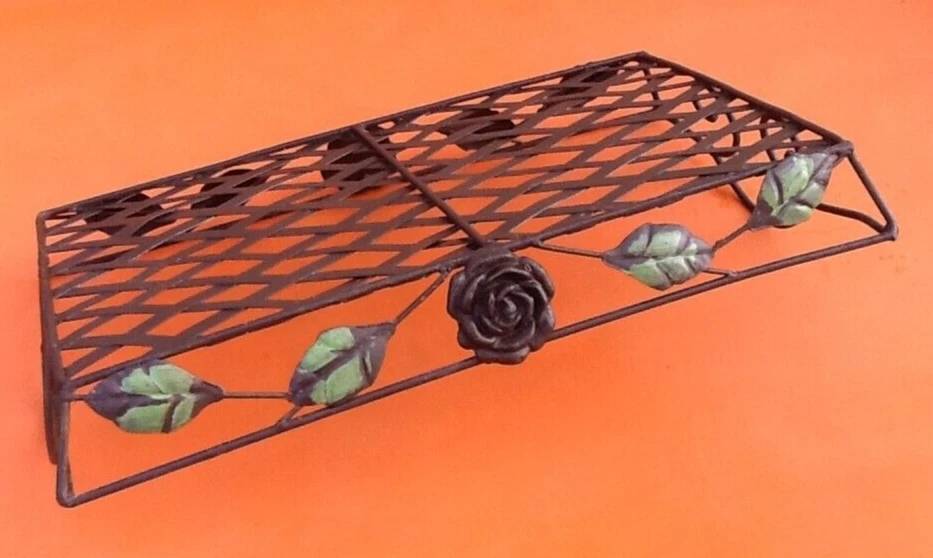 Rectangular metal serving tray with floral decoration.