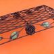 Rectangular metal serving tray with floral decoration.