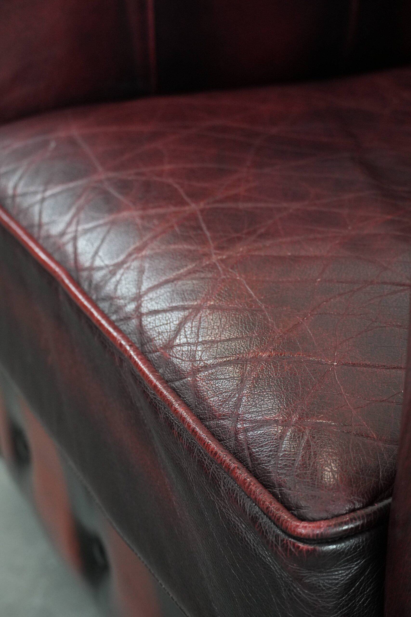 Cowhide leather English chesterfield armchair on wheels