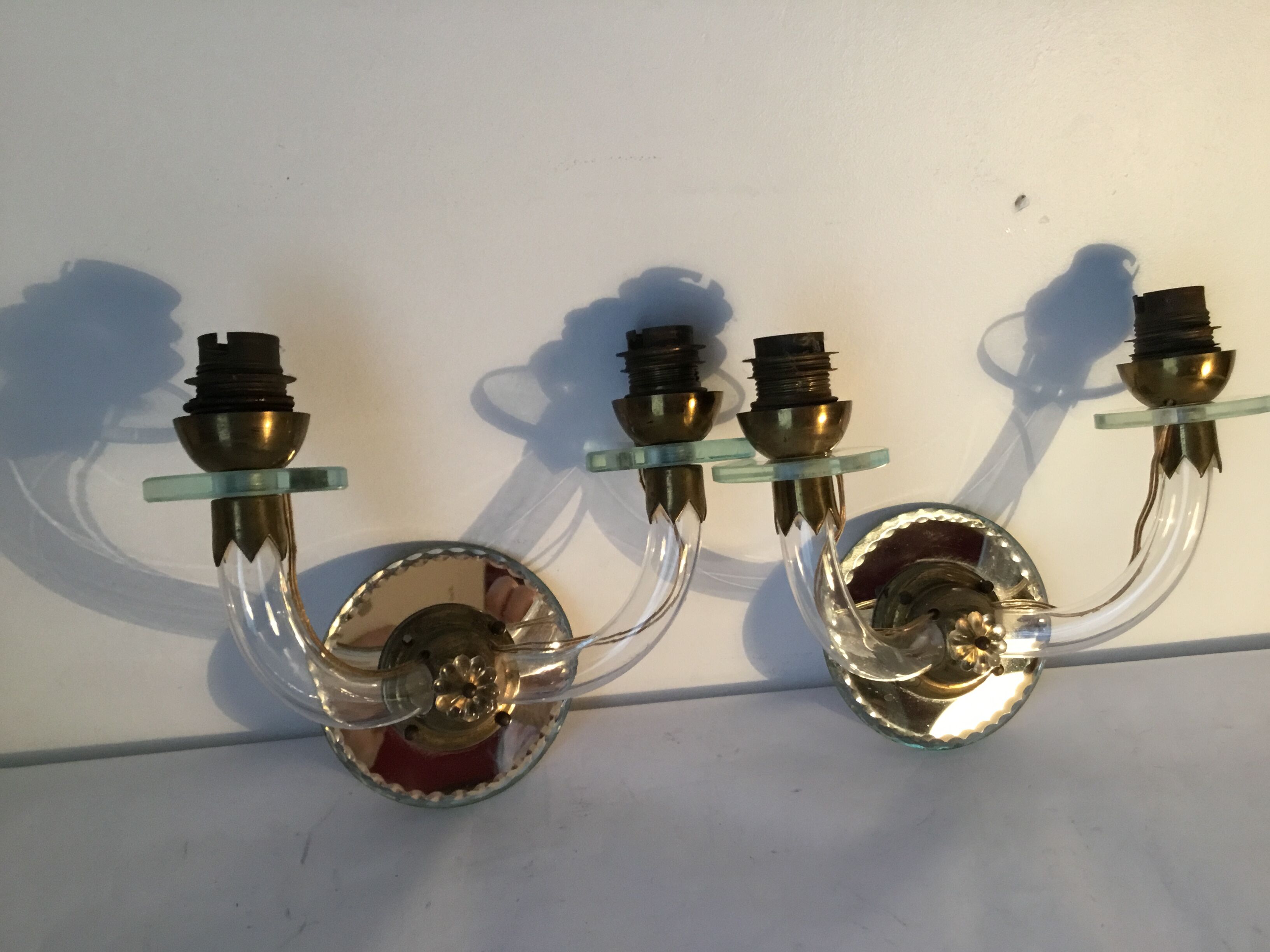 Pair of glass and mirror sconces