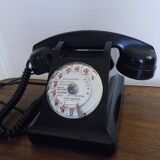 Black bakelite phone with earphone