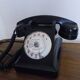 Black bakelite phone with earphone