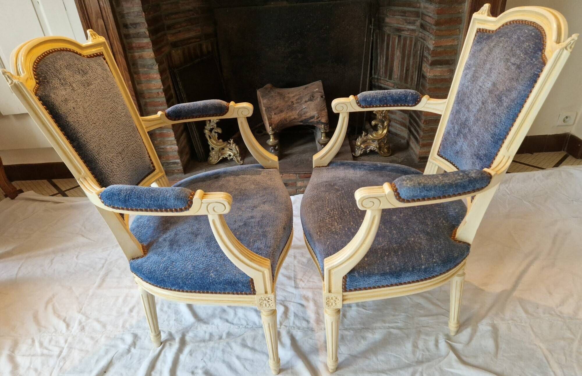 Pair of Louis XVI cabriolet armchairs in cream and blue French elegance late 19th century