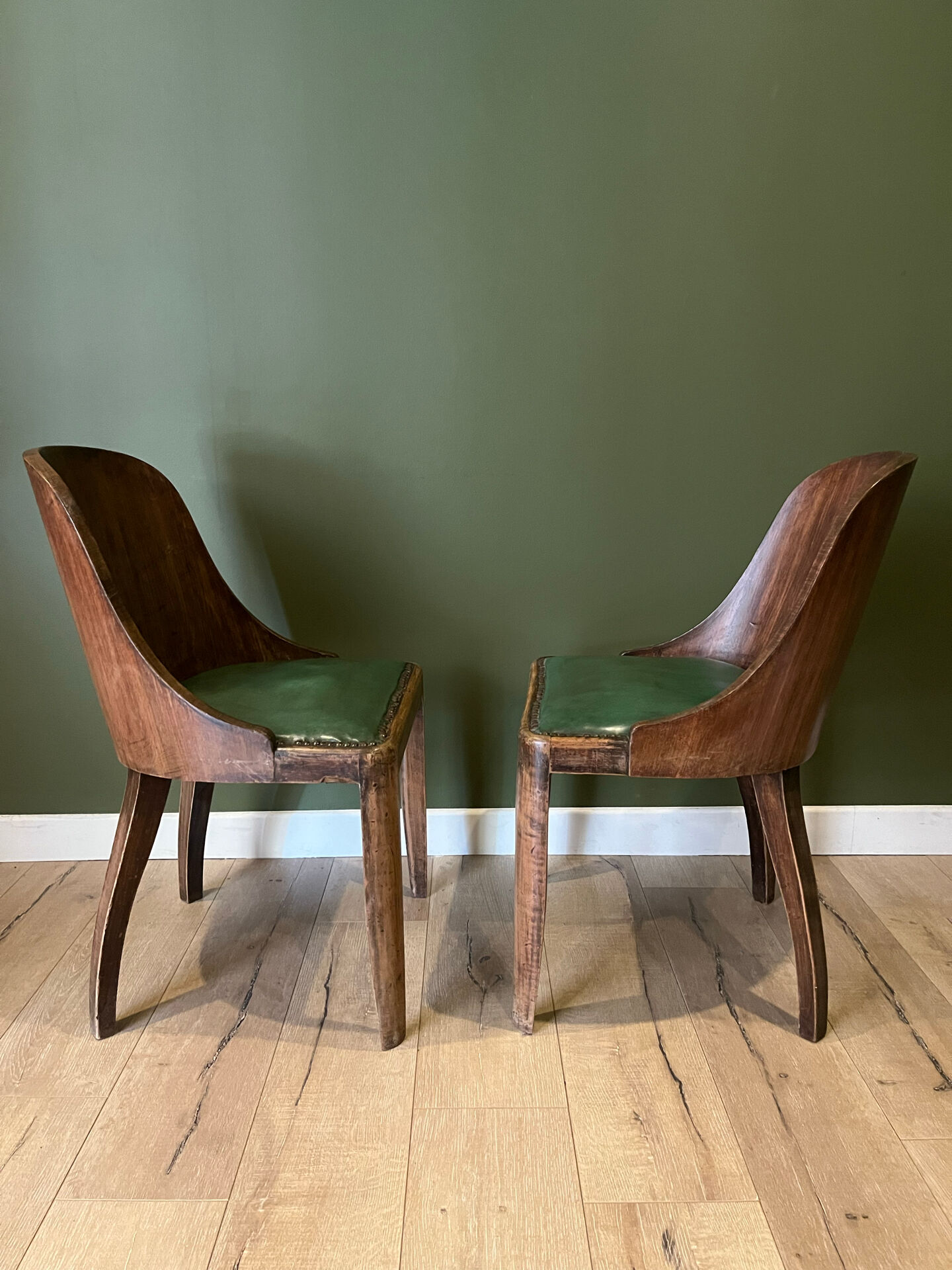 Pair of green leather gondola chairs Art Deco by De Coen