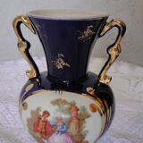 Revol porcelain vase, showcase object, romantic decor, blue background, golden handles