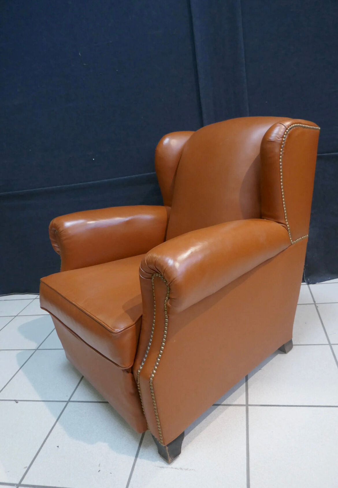 Club armchair with ears of the 40s/ 50s in restored leather