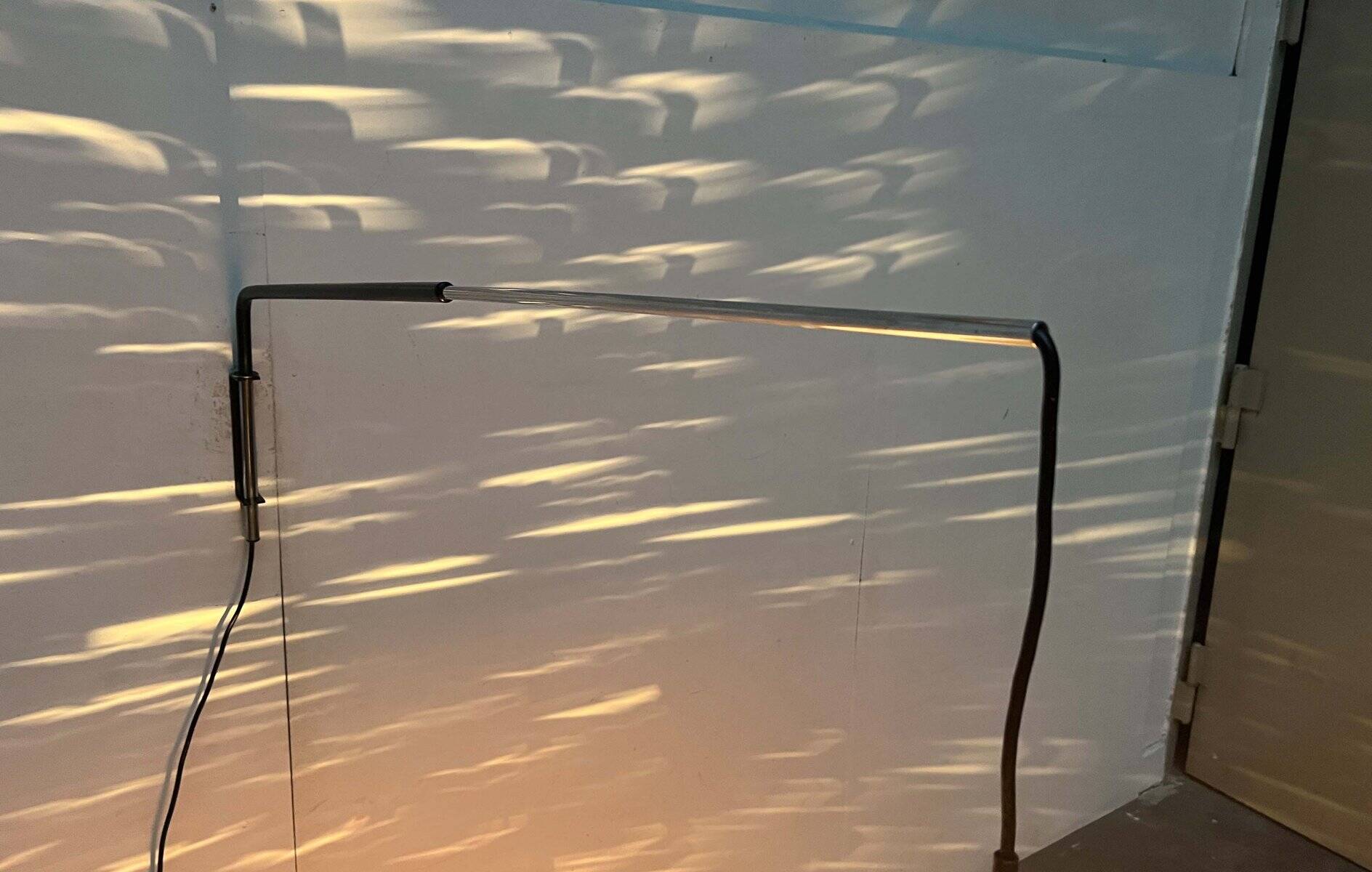 Mid-century modern Danish extendable cantilever wall lamp with a rattan shade, 1960s.