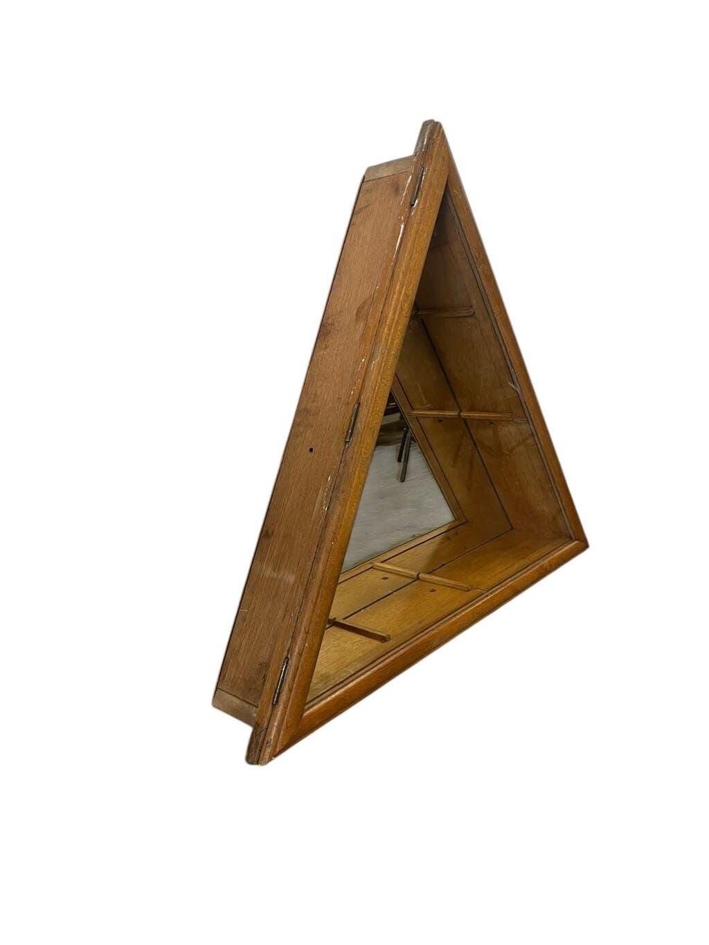 Vintage shallow wall display cabinet with a mirrored back.