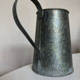 Old garden pitcher vase in folded zinc