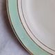Flat antique earthenware plates with gilded edges
