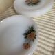 Lots of vintage plates in arcopal floral pattern