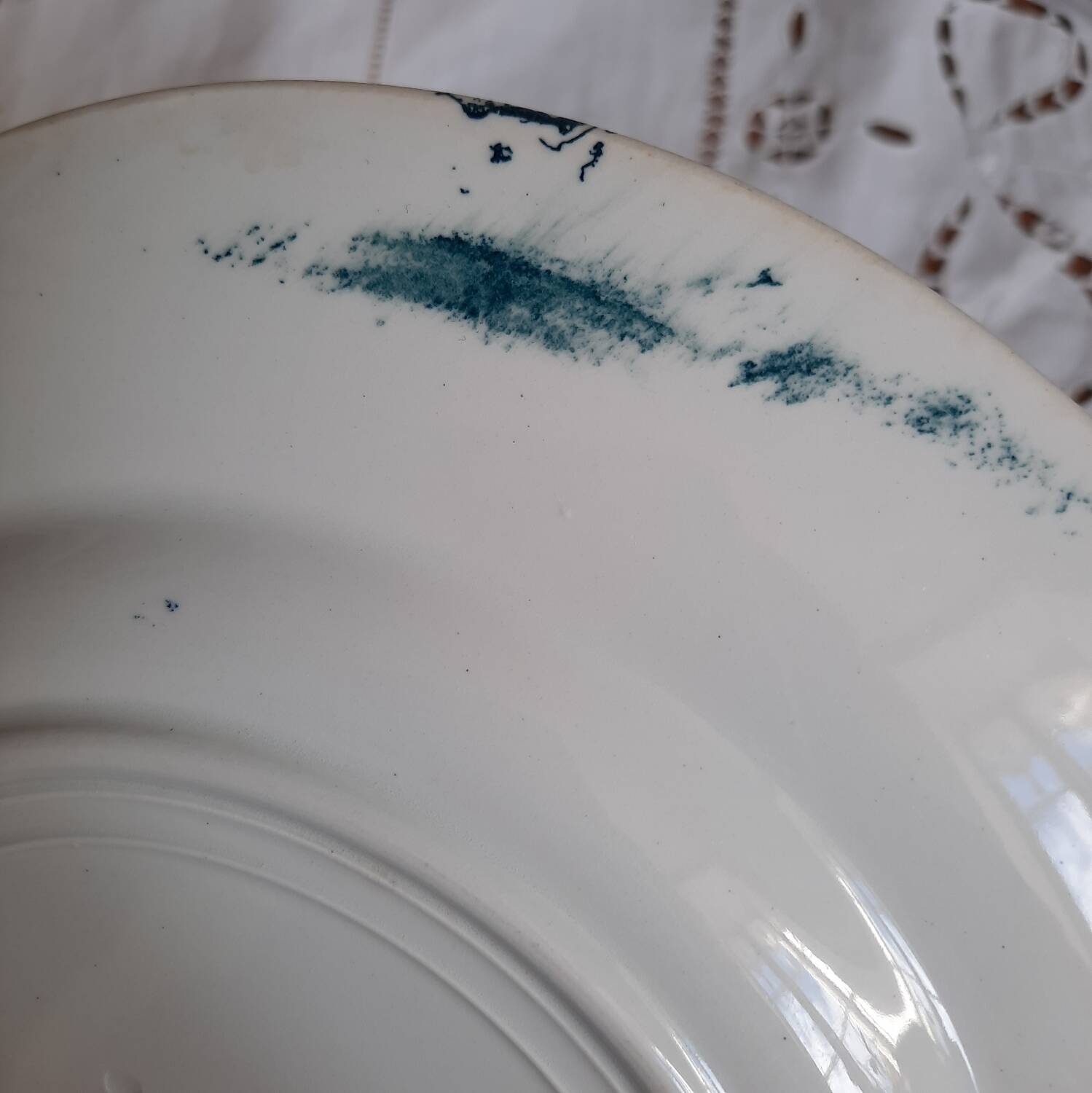 Old mismatched dinner plates accompanied by a dish