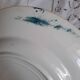 Old mismatched dinner plates accompanied by a dish