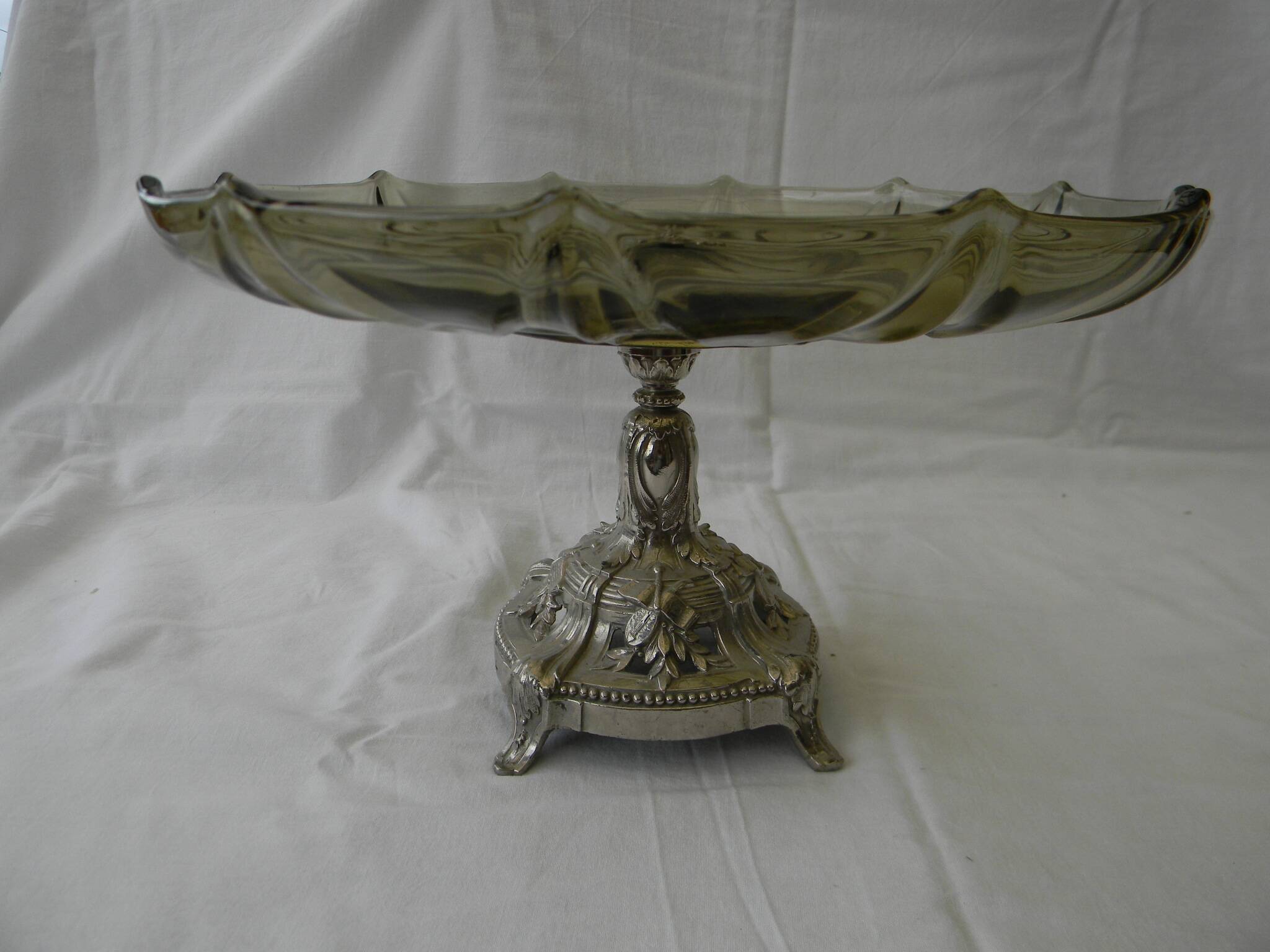 Large smoked glass fruit bowl with a metal base.