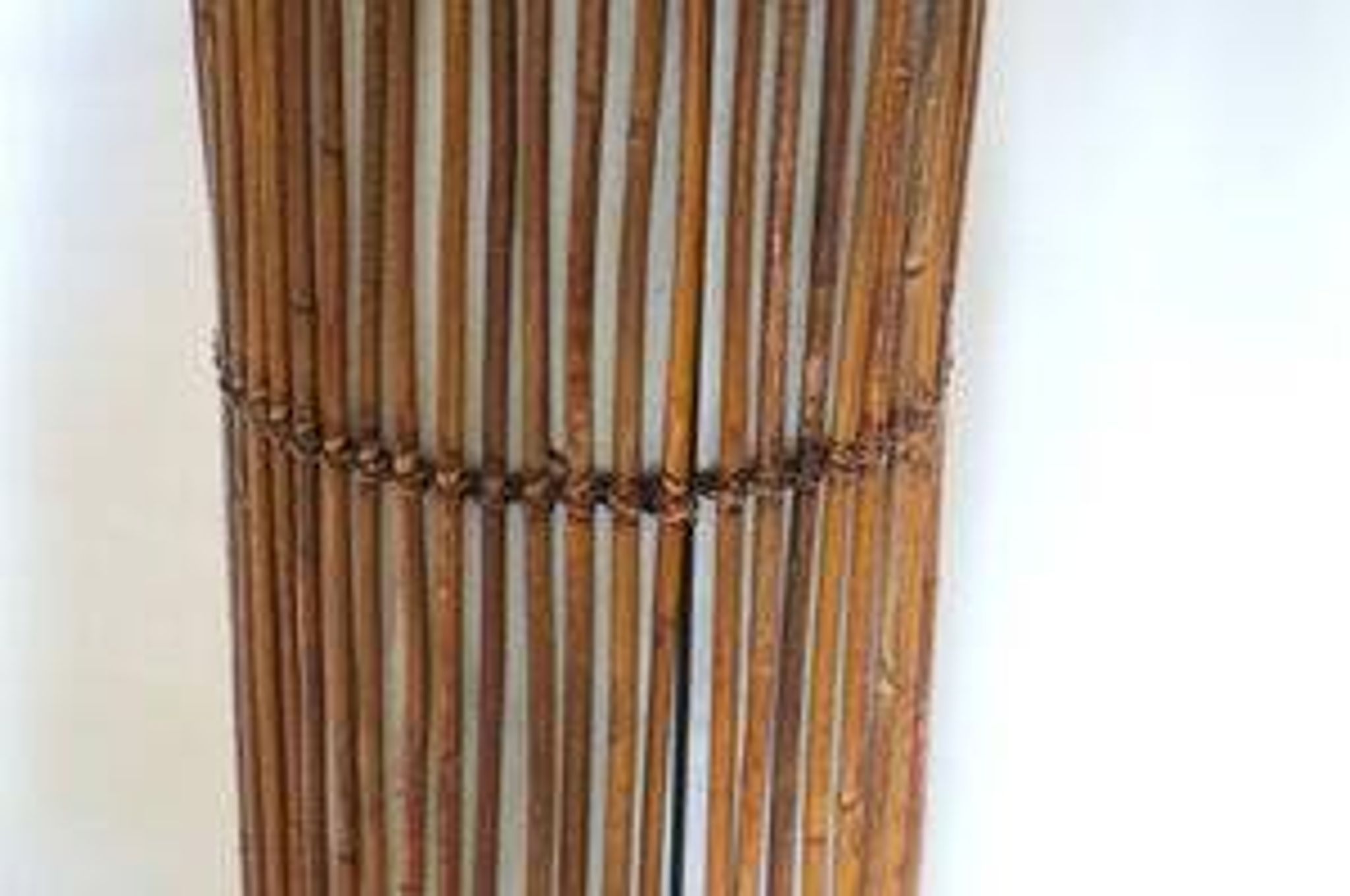 Mid-century rattan floor lamp, in the style of Louis Sognot.