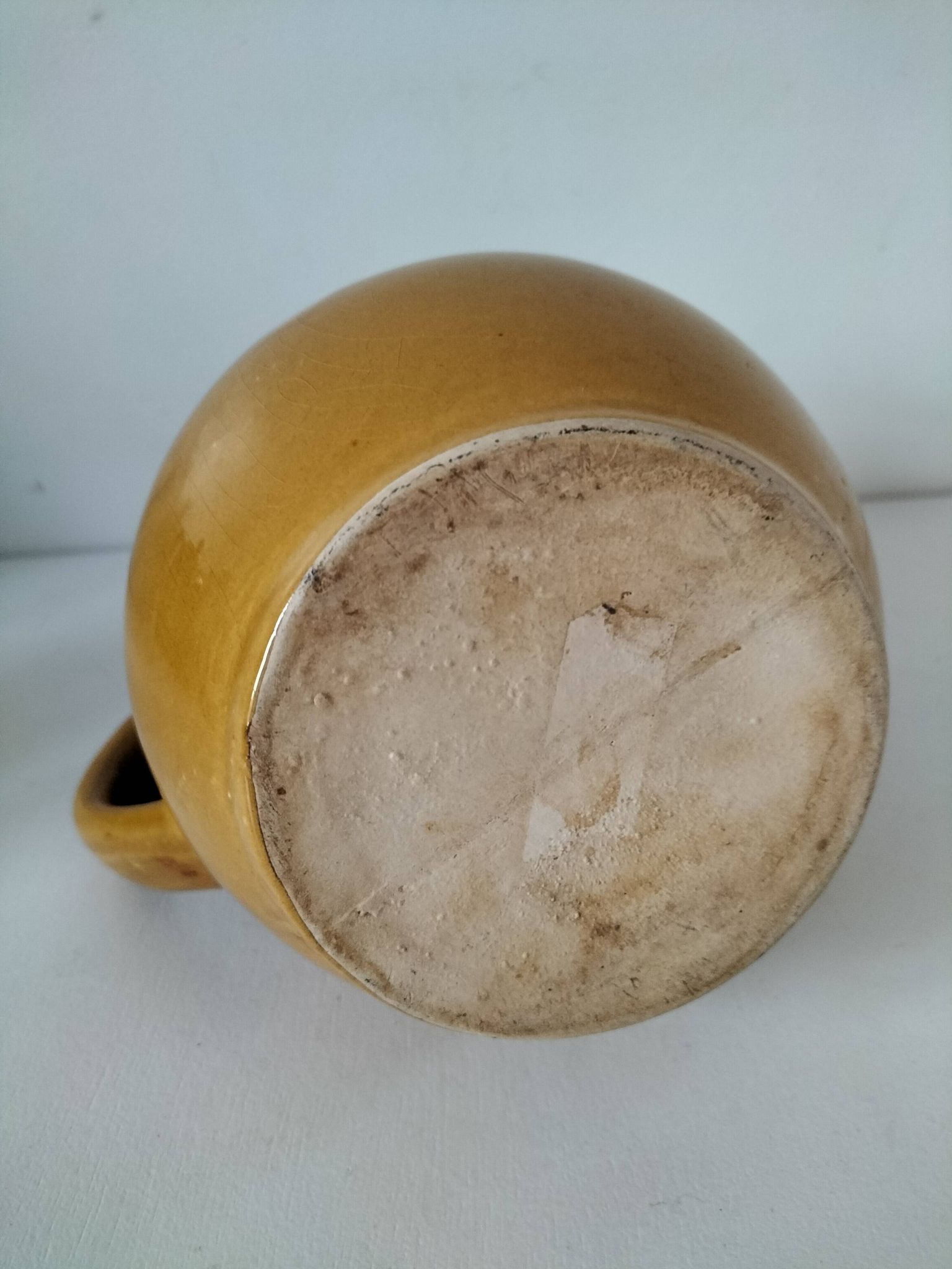 Glazed earthenware jug